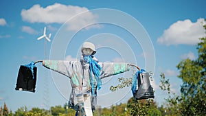 A scarecrow in the background, a small wind generator in the background