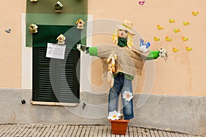 Scarecrow, decorated with flowers, birds and birdhouses, on Costitx en Flor photo