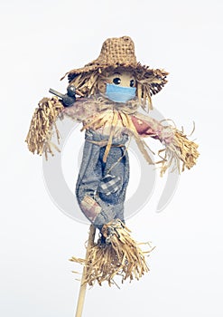Scarecrow doll wearing a mask