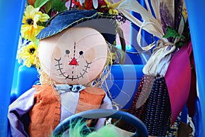 Scarecrow Driving Childs Car photo