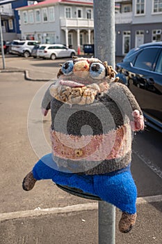 Scarecrow in a post in Akureyri, Iceland