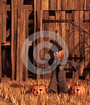 Scarecrow pumpkin in front of old barn