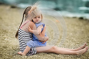 Scarecrow sister lovingly embraces his sister with Down syndrome photo