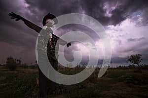 Scarecrow in stormy weather background