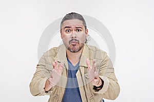 A scared and alarmed man desperately pleading. A crook in a futile attempt to make an alibi. Isolated on a white background