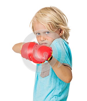 Scared angry boy with boxing gloves