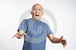 scared bald man with bulging eyes expression