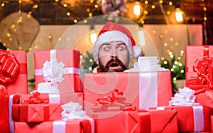 Scared bearded man. winter shopping sales. Cheerful elf. christmas gift delivery. Boxing day. hipster santa hat