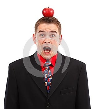 Scared business man with apple on head