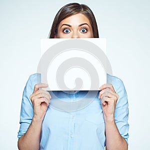 Scared business woman hide face with white sign board.