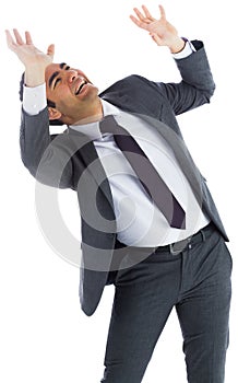 Scared businessman with arms raised