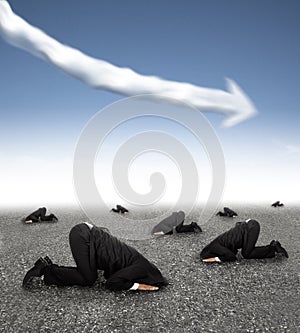 Scared businessman hiding on the ground with business graph down