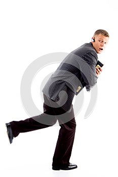 Scared businessman running