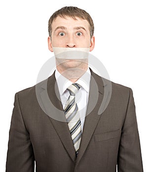 Scared businessman with tape over his mouth