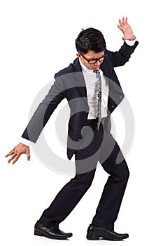 Scared businessman walking on invisible.