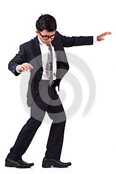 Scared businessman walking on invisible
