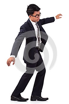 Scared businessman walking on invisible.