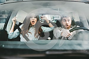 Scared couple in car