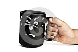 Scared cup held by a hand