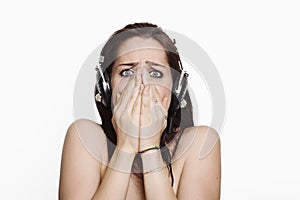 Scared girl listening to music