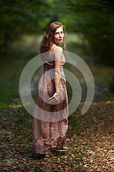 Scared girl running through forest