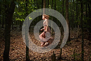 Scared girl running through forest