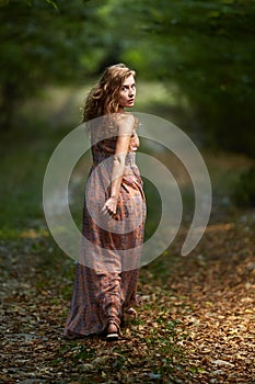 Scared girl running through forest