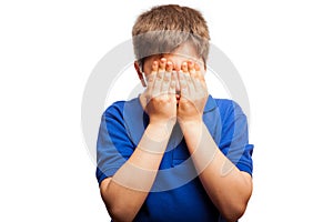 Scared kid covering his face