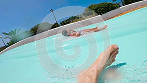 Scared man face descending extreme water slide. Sliding from first person view. Water Park on summer vacation