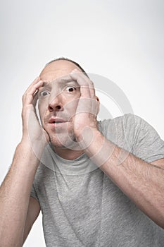 Scared Man With Hands Covering Face