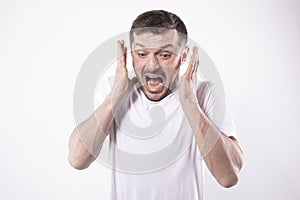 Scared man, hands in a panic pose. Isolated on white background. Human emotions