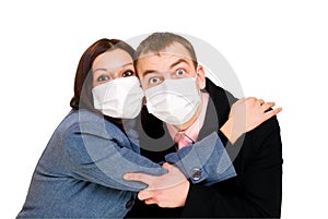 Scared man and woman dressings mask