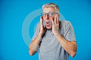 Scared middle age man nervous expressing anxiety and panic gesture