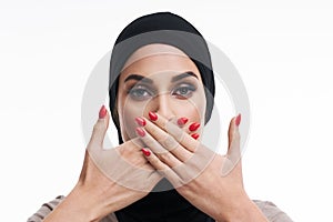 Scared muslim woman over white background