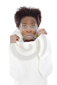 Scared and shocked african american black woman in white sweater