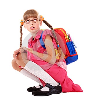 Scared sitting schoolchild in eyeglasses.