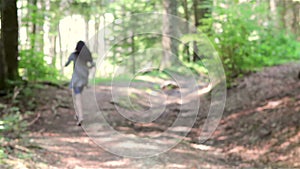 Scared teenage girl running in the forest
