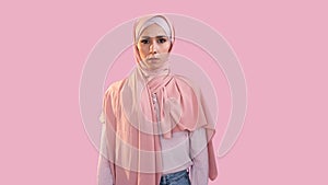 Scared woman fear anxiety overwhelmed face hijab
