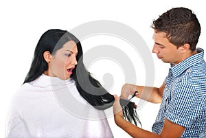 Scared woman and hairstylist at hair salon photo