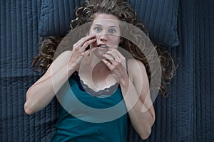 Scared woman having nightmare photo