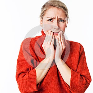 Scared woman hiding her face with her hands for anxiety