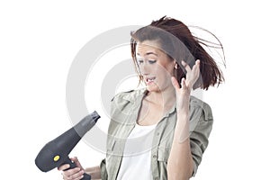 Scared woman holding hair dryer