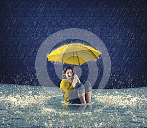 Scared woman holding an umbrella while it raining