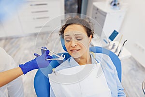 Scared woman visiting dentist