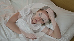 Scared Young Woman having Nightmare in Bed