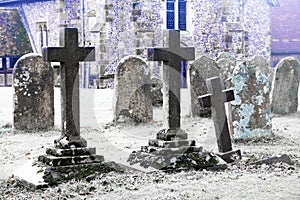Scarey grave yard with ano old church behind black and white photograph photo