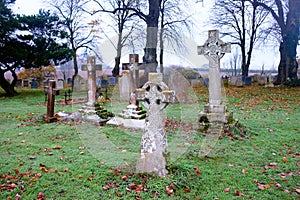 Scarey grave yard with crosses as head stones photograph photo