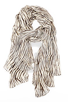 A scarf is silk beige with strakes strung on a knot