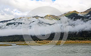 Scarfs of clouds in Haast River valley