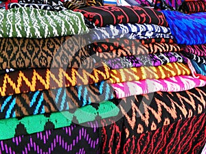 Scarfs or Macanas at the market, traditional handcraft and design for Gualaceo canton, Cuenca, Ecuador photo